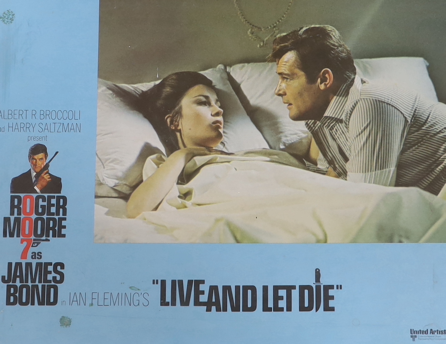 A James Bond 007 Live and Let Die framed original film lobby card, colour lithograph dated 1973 and ‘Litho in U.S.A.’ along bottom edge, frame 39.5cm x 47.5cm